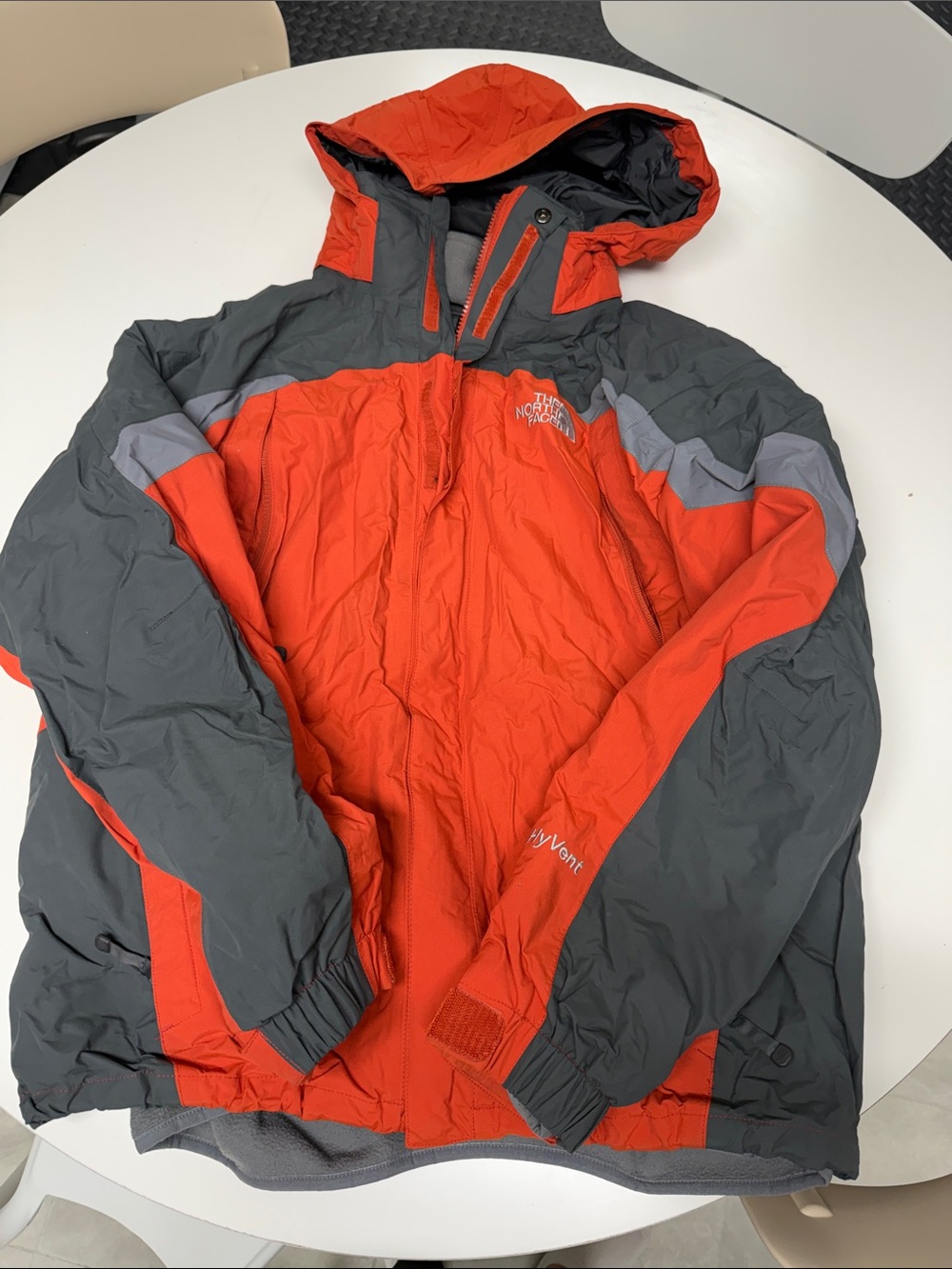 The North Face Men’s Orange and Gray Hooded Shell Jacket